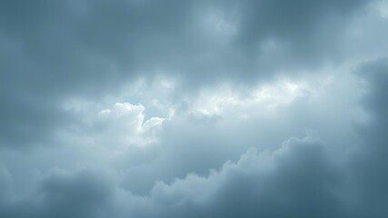 misty mysterious sky with dense clouds of white and gray deep blues and greens in the shadows, misty atmosphere, wintery scene, soft focus