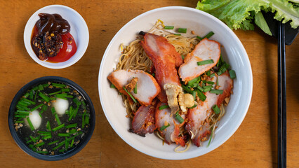Char siu pork noodles. Chinese barbecue roast pork noodle (Char Siu) in a bowl. Dry noodles top with char siu. 