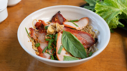 Char siu pork noodles. Chinese barbecue roast pork noodle (Char Siu) in a bowl. Dry noodles top with char siu. 