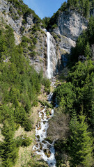 dalfazer waterfall during Spring time with deep blue background sky