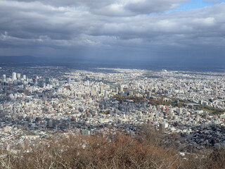 Obraz premium HeIght view with panoramic scenery in Sapporo Japan. Moiwa Ropeway with blur sky and cloudy