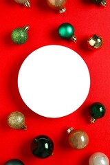 Festive Christmas background with various balls and paper card, copy space composition