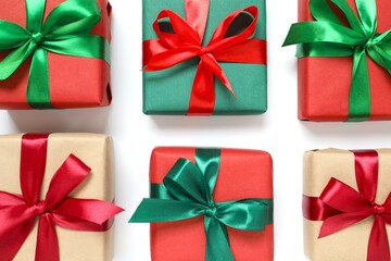 Beautiful gift boxes tied with bows on white background 