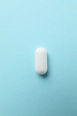 White pill on a color background