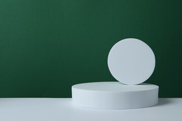 White podiums on color background 