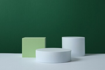 White podiums on color background 