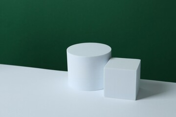 White podiums on color background 