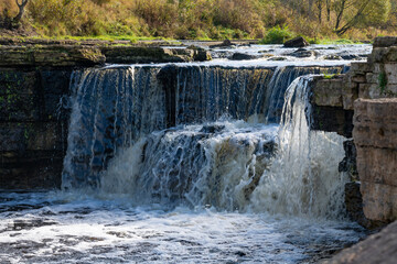 The central part of the Tosnensky waterfall on a sunny October day. Tosna River, Ulyanovka....