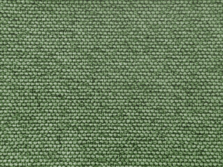 Close up texture of green upholstery fabric, made of cotton and wool in a scaled square pattern. Dark green fabric suitable for clothing. Seamless background fabric texture.