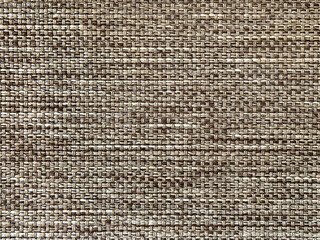 Close up texture of dark mocha brown upholstery fabric, made of cotton and polyester knitted and woven. Suitable for cushion and curtain drapery. Seamless background fabric texture.