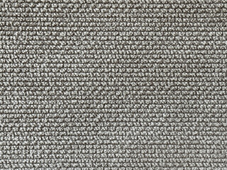 Close up texture of grey brown upholstery fabric, made of cotton and polyester knitted and woven. Suitable for sofa, carpet, or drapery. Seamless background fabric texture.