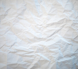 Abstract white background. Background crumpled from recycled paper on which you can see the crumpled structure.