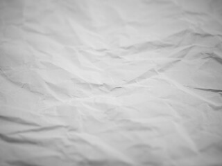 Abstract white background. Background crumpled from recycled paper on which you can see the crumpled structure.