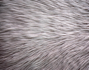 Abstract fur background made of artificial brown fur.