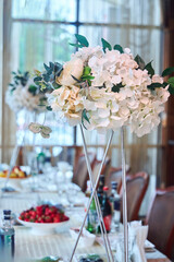 Artificial flowers for the holiday decor. The work of a florist or designer.