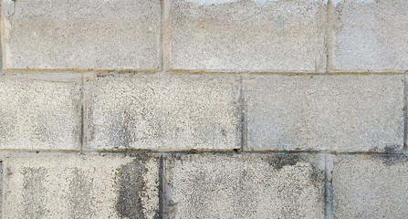 Fototapeta premium Old concrete wall, not plastered, texture rough surface ,dirty cinderblocks wall background 