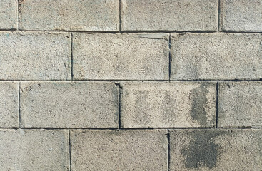 Obraz premium Old concrete wall, not plastered, texture rough surface ,dirty cinderblocks wall background 
