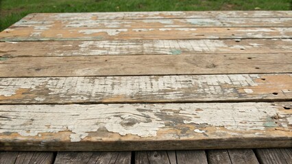 Distressed wooden board with multiple cracks and peeling paint, wooden decor, peeling edges