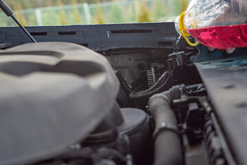 pouring antifreeze into a car radiator