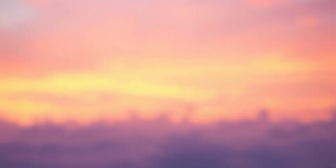 Obraz premium Soft focus sunset sky with shades of yellow gold and pink blended into purple hues and wispy fringing in soft blue tones, atmospheric lighting, soft pink undertones