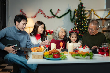 Dinner and Family holiday celebrating, together at Merry Christmas and  New Year. in a cozy festive home setting.