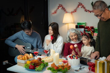 Dinner and Family holiday celebrating, together at Merry Christmas and  New Year. in a cozy festive home setting.