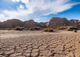 Desert sand ground and Yardang landform mountain natural landscape in Xinjiang, China. Road trip in...