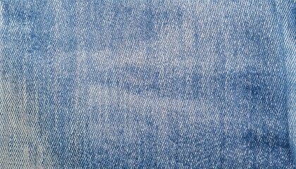 Light blue denim fabric texture background showing unique detail and pattern of the weaving