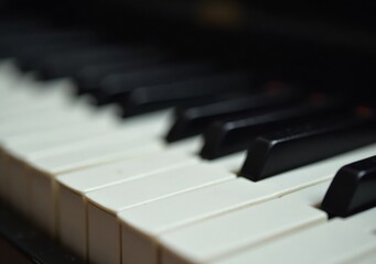 Fototapeta premium Close-up view of piano keys highlighting textures and musical potential