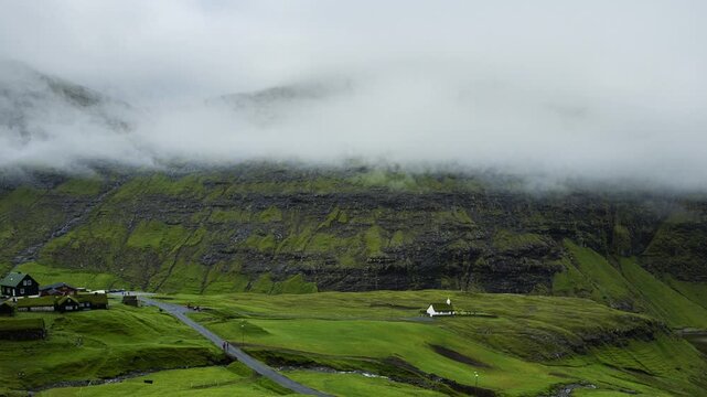 Time lapse of summer rural landscape scenery of Saksun village with typical turf - top houses, Faroe Islands. Denmark, Europe.