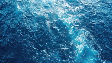 Obraz premium Deep blue ocean waves texture. Perfect for backgrounds, travel sites, or marine-themed designs.
