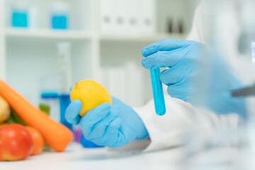 Scientist check chemical food residues in laboratory. Control experts inspect quality of vegetables...