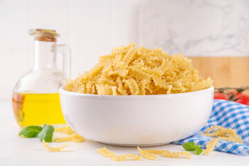 Raw Mafaldine pasta with ingredient for cooking