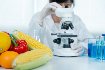 Scientist check chemical food residues in laboratory. Control experts inspect quality of fruits,...