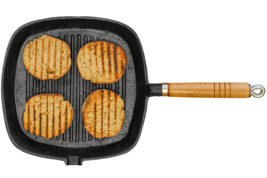 Top view of four slices of toasted bread in a griddle pan