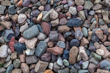 Close-up of small stones as nature background. Copy space. Stones on railway embankment