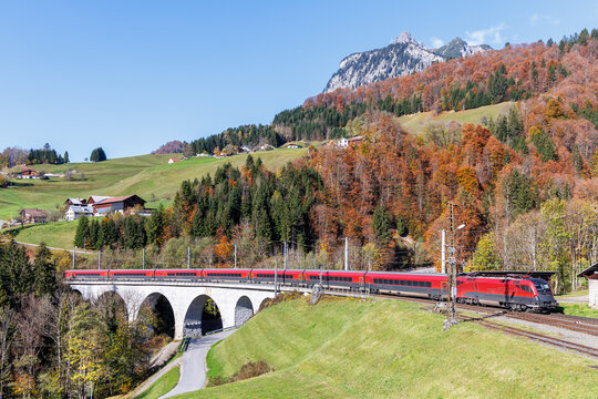 Railjet passenger train of Austrian Federal Railways &Ouml;BB on Arlberg railway line in autumn in the Austrian Alps in Dalaas, Austria