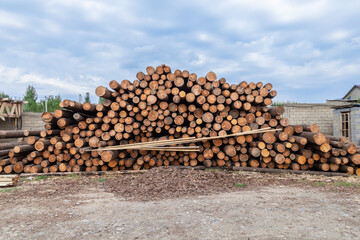 Photo of a pile of natural wooden logs