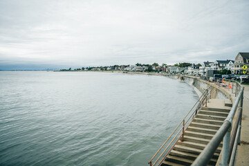 Fototapeta premium Gloucester city and Pavilion Beach aerial view, Gloucester, Cape Ann, Massachusetts MA, USA.