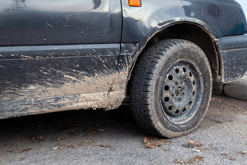 car in mud after driving on dirty roads