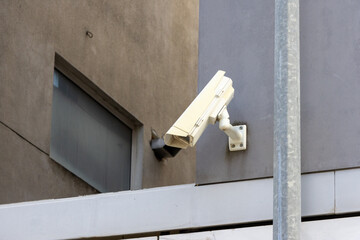 Security camera monitoring building entrance for safety and surveillance