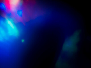 A colorful, blurry background with a rainbow of colors. The colors are bright and vibrant, creating a sense of energy and excitement. Abstract design wall paper. Cinematic light effect.