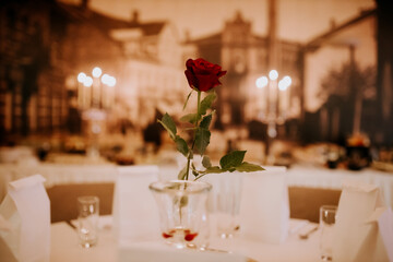 Single Red Rose Centerpiece with Vintage Banquet Backdrop