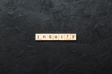 inquiry word written on wood block. inquiry text on table, concept