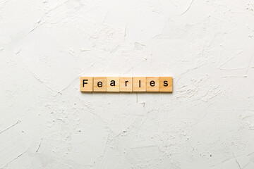 Fearless word written on wood block. Fearless text on cement table for your desing, concept