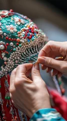 Skilled artisan meticulously creates detailed designs on a Peking opera headdress with beads