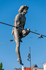 Passing through the river - a sculpture suspended on a rope by the Brda River. Bydgoszcz, Kuyavian-Pomeranian Voivodeship, Poland	
