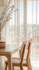 Obraz premium A serene dining area with a wooden table, two chairs, and a decorative plant by a window.