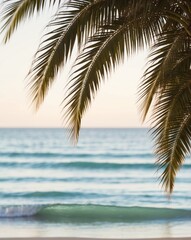 Fototapeta premium A tranquil beach view with palm fronds swaying gently over the shimmering turquoise waves.