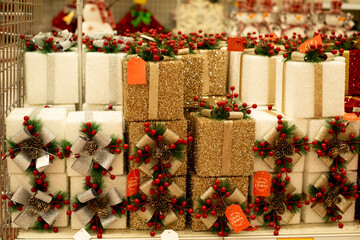 Christmas gifts beautifully decorated on a shelf in a store. New Year and Christmas Sale. 2025 Christmas